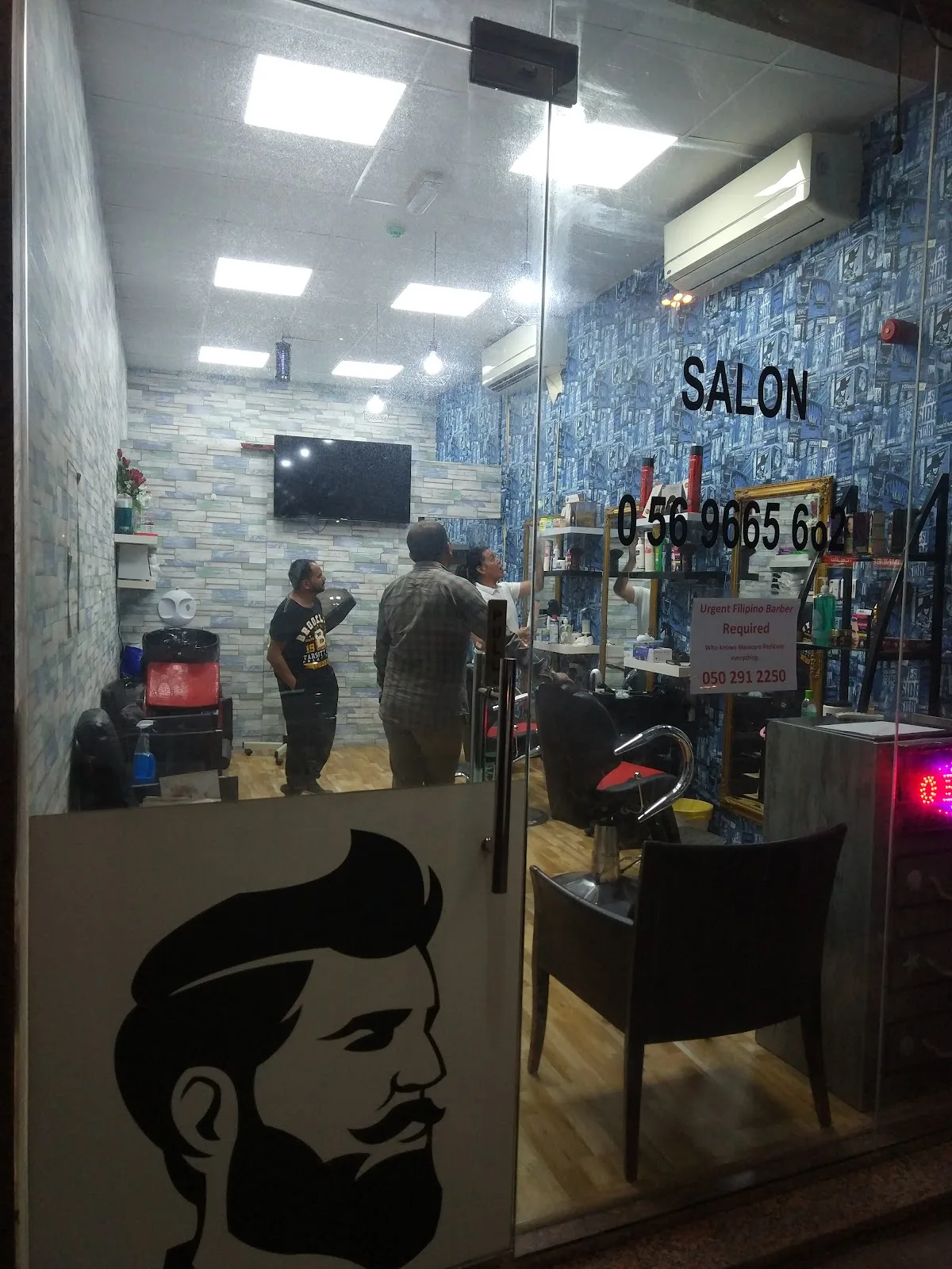 Glass shopfront and entrance of Cuts Asylum on Al Dhiyafah Road