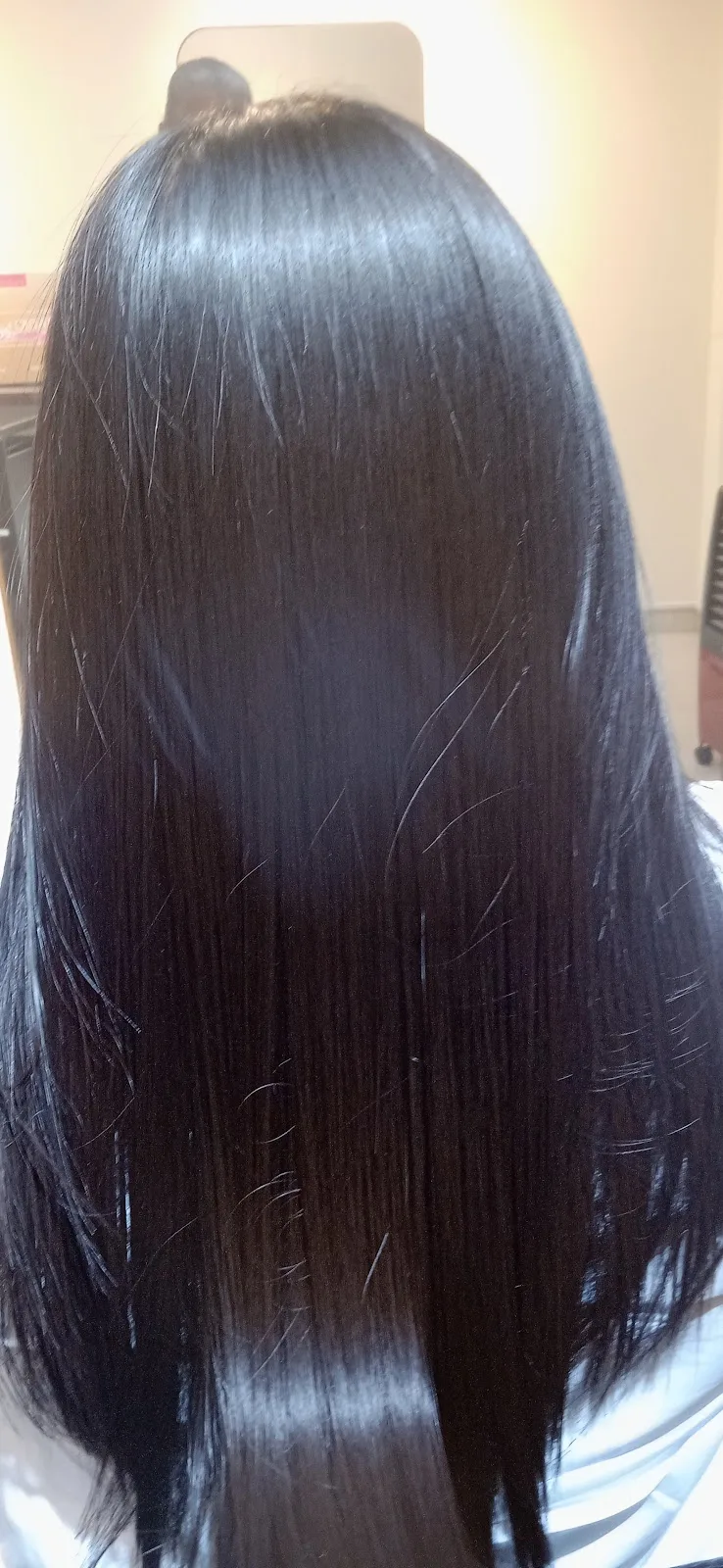 Glossy straightened black hair