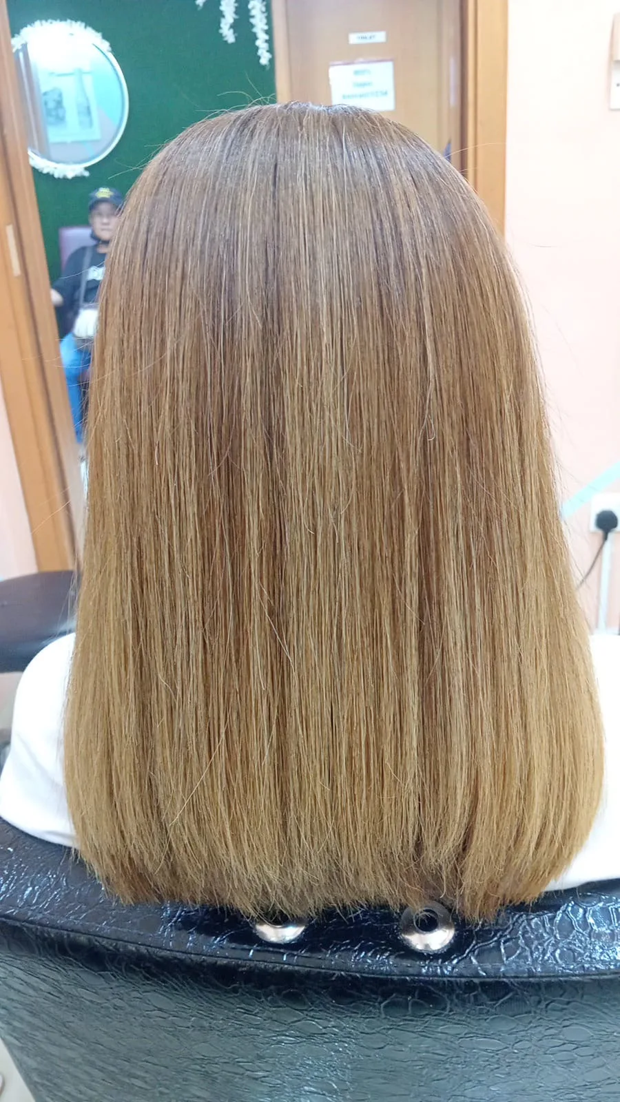 Healthy honey-brown straightened hair