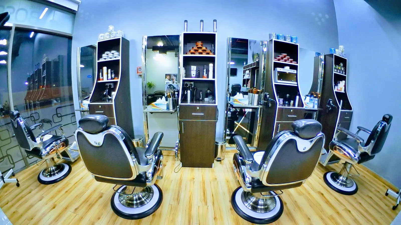 Barber stations with mirrors, chairs and styling products