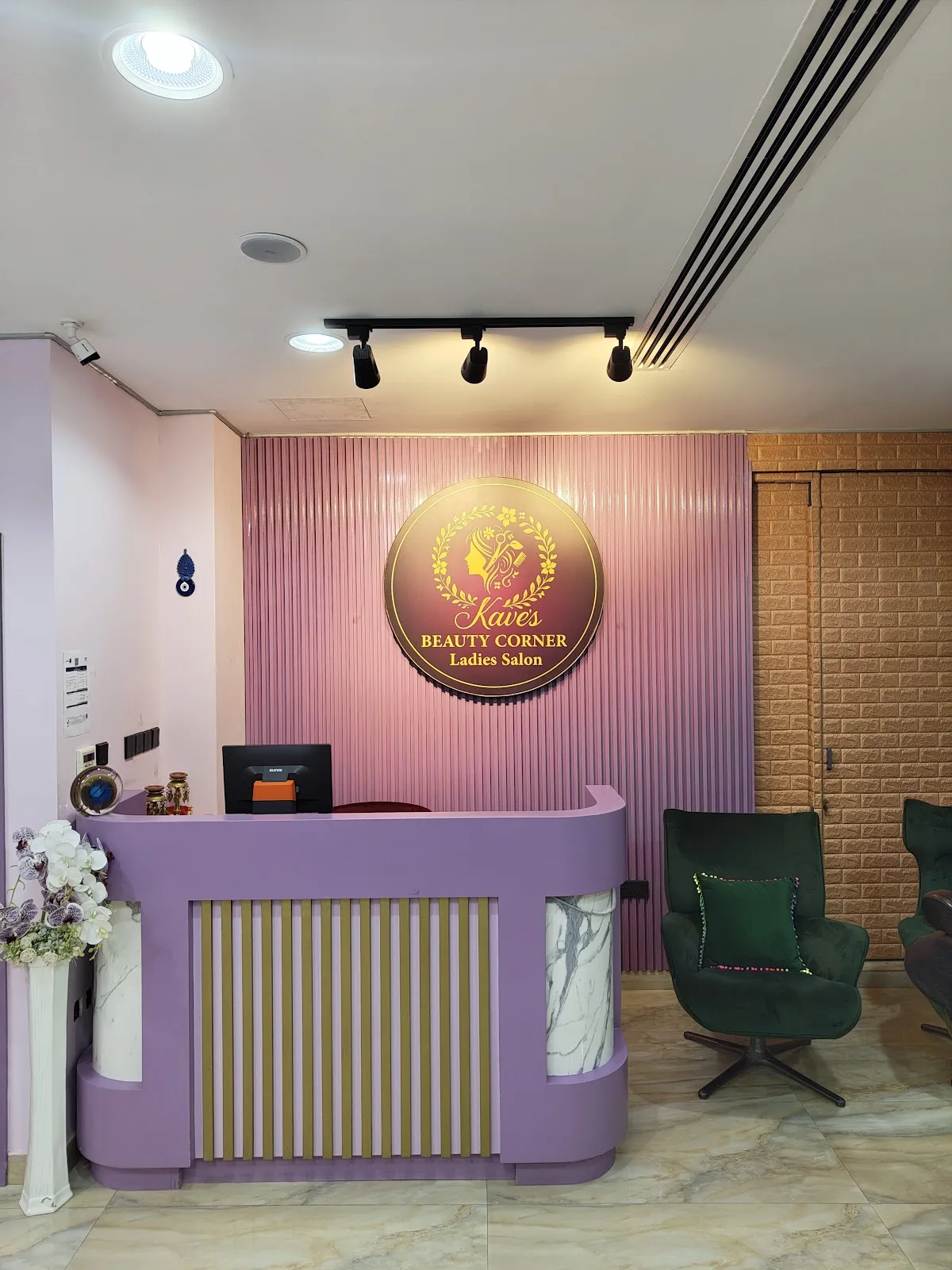 Reception desk and signature wall sign at Kave's Beauty Corner