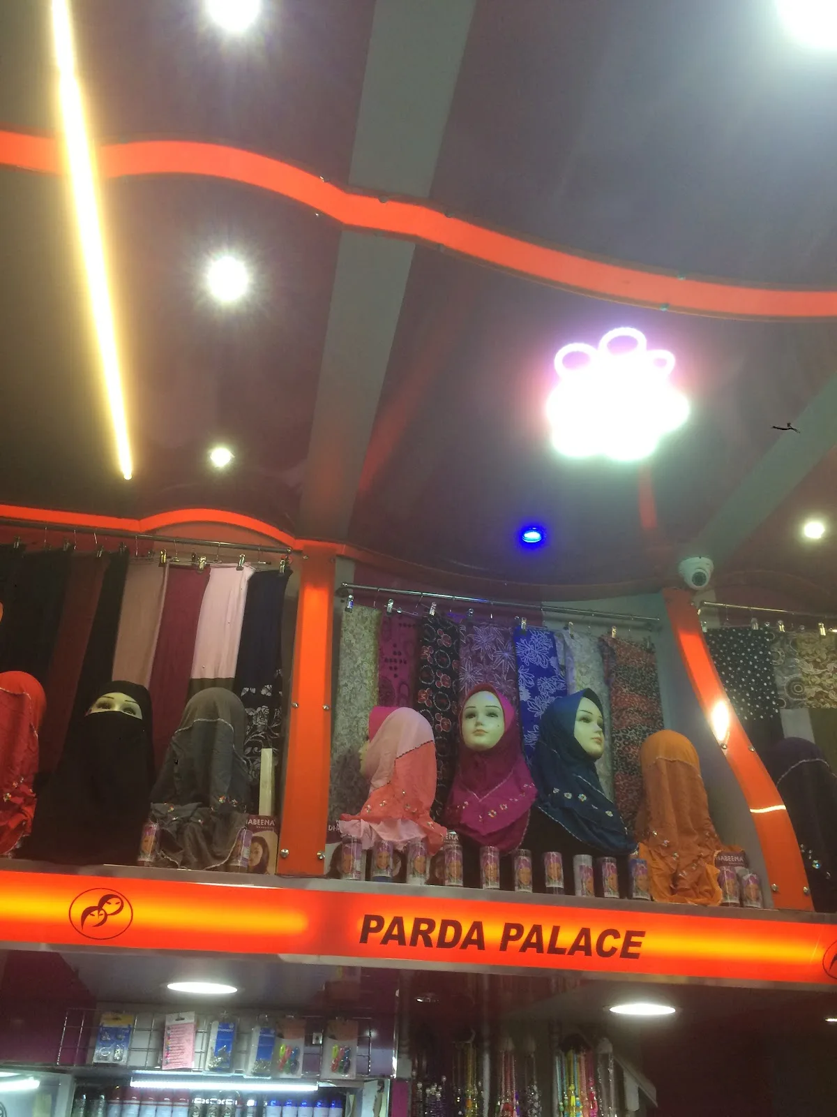 Wall of colourful hijabs and scarves on display