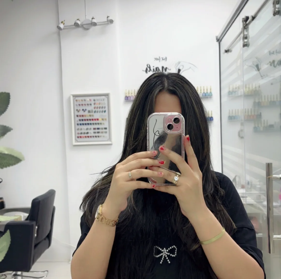 The bright nail studio with a wall of polish shades