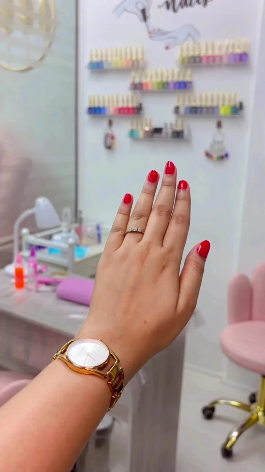 Fresh glossy red manicure at the nail studio