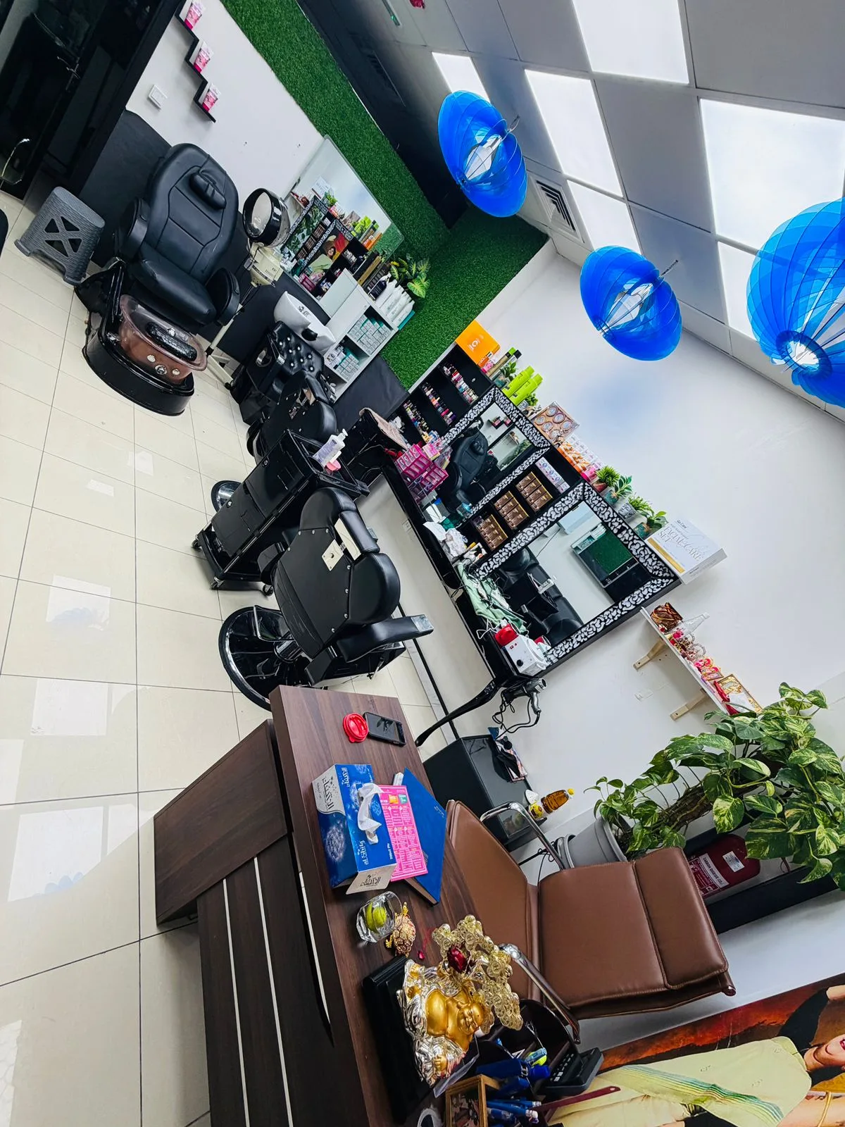 Inside Ayoni Ladies Beauty Salon — styling chairs, mirrors and product shelves