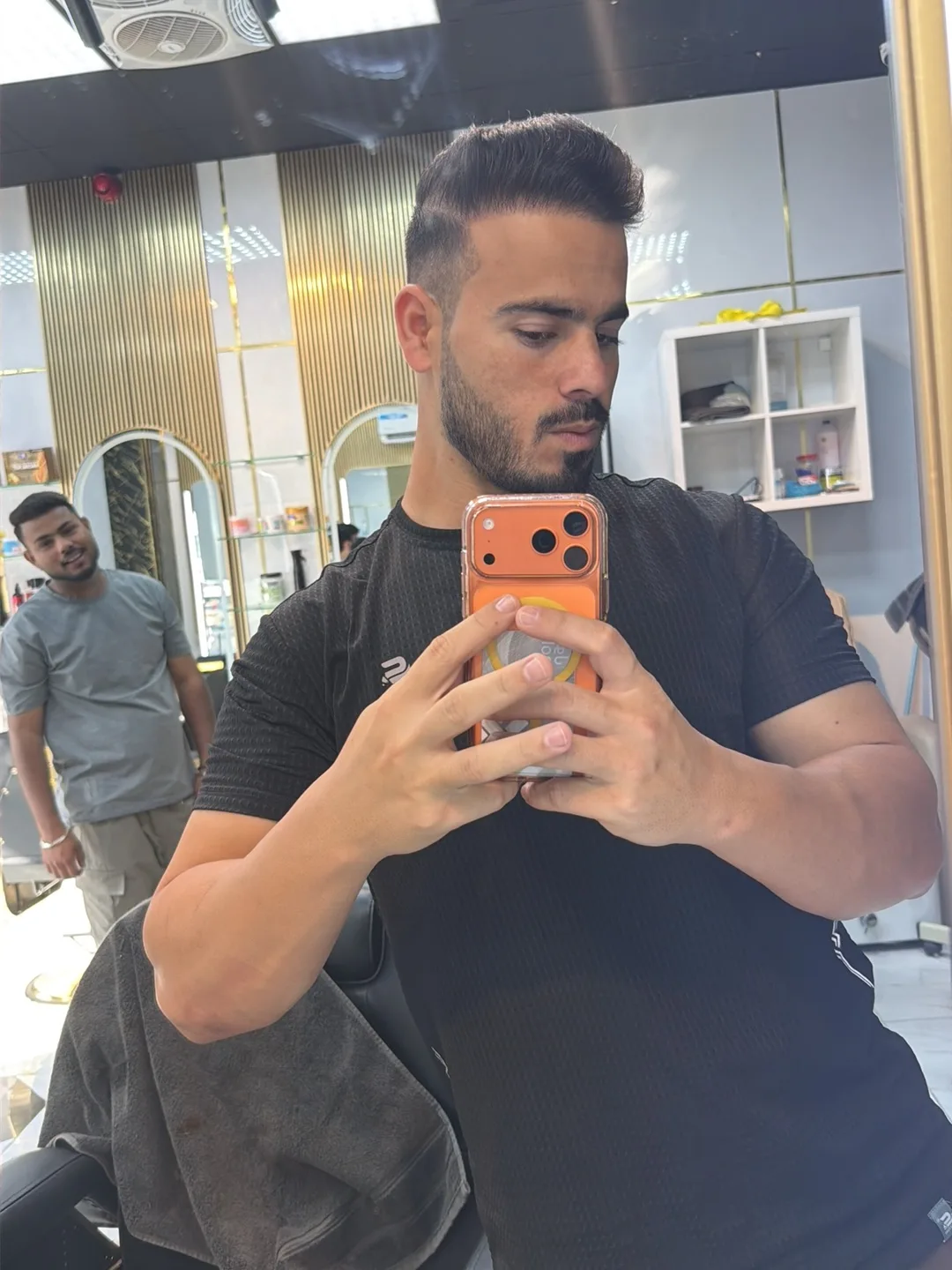 A clean quiff and skin fade finished at Noor Al Khaima Gents Salon