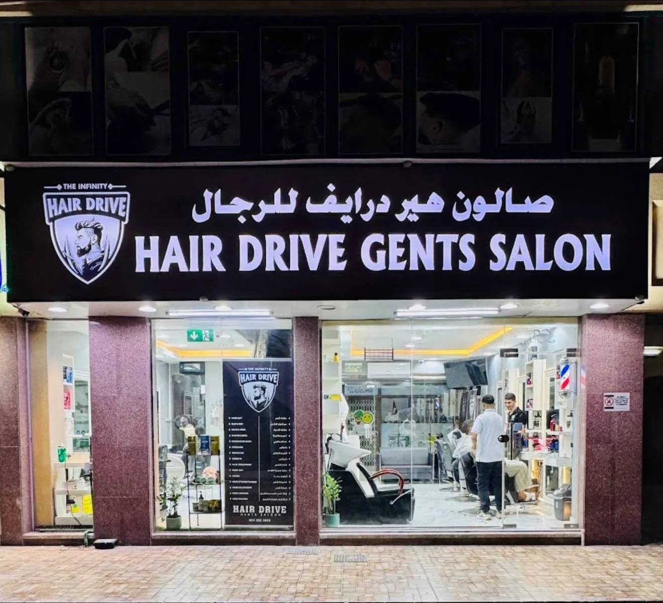 HAIR DRIVE Gents Salon illuminated black storefront sign with the shield logo in Al Twar 1, Dubai