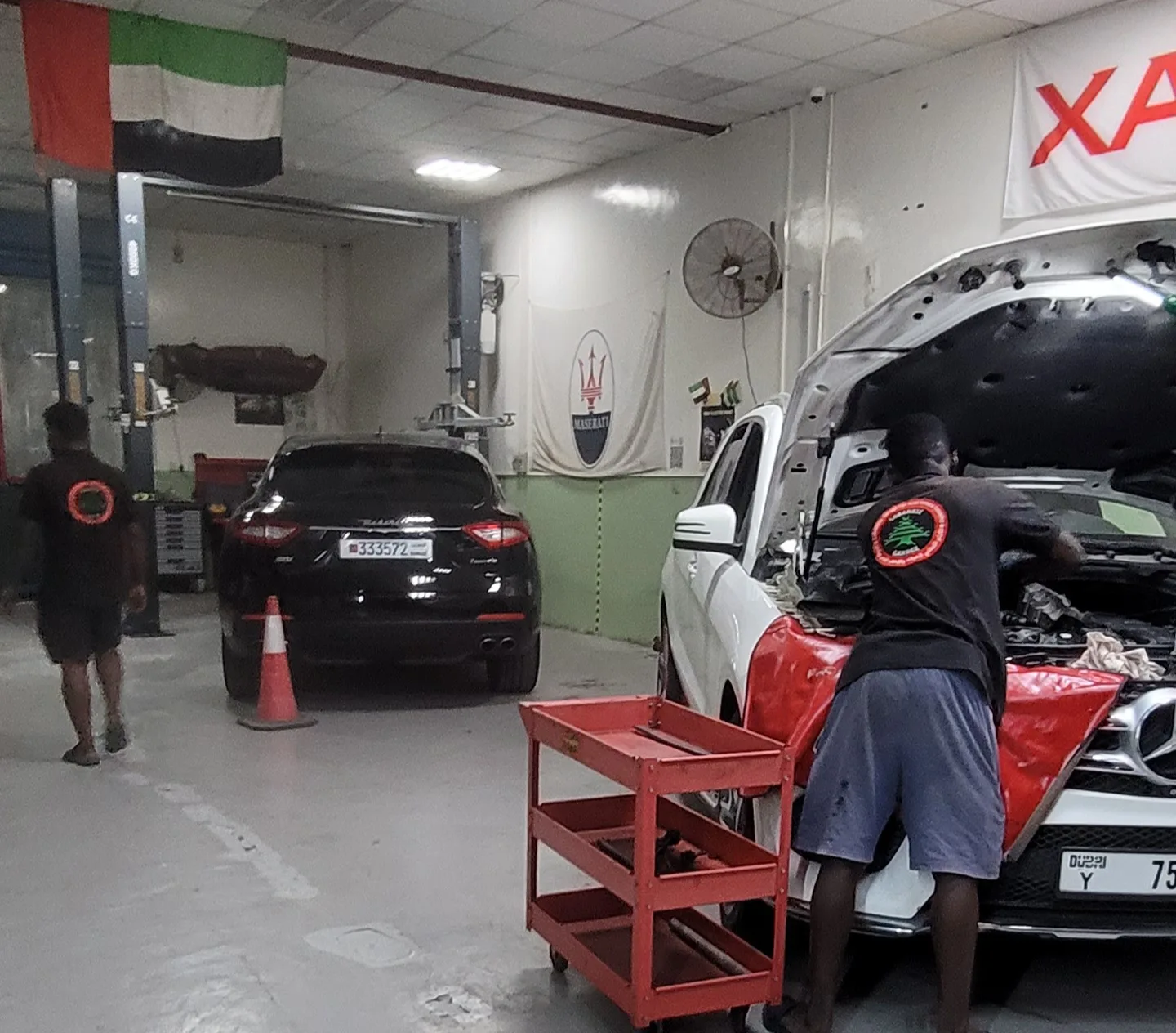 Lebanese Garage mechanics working on a Mercedes engine