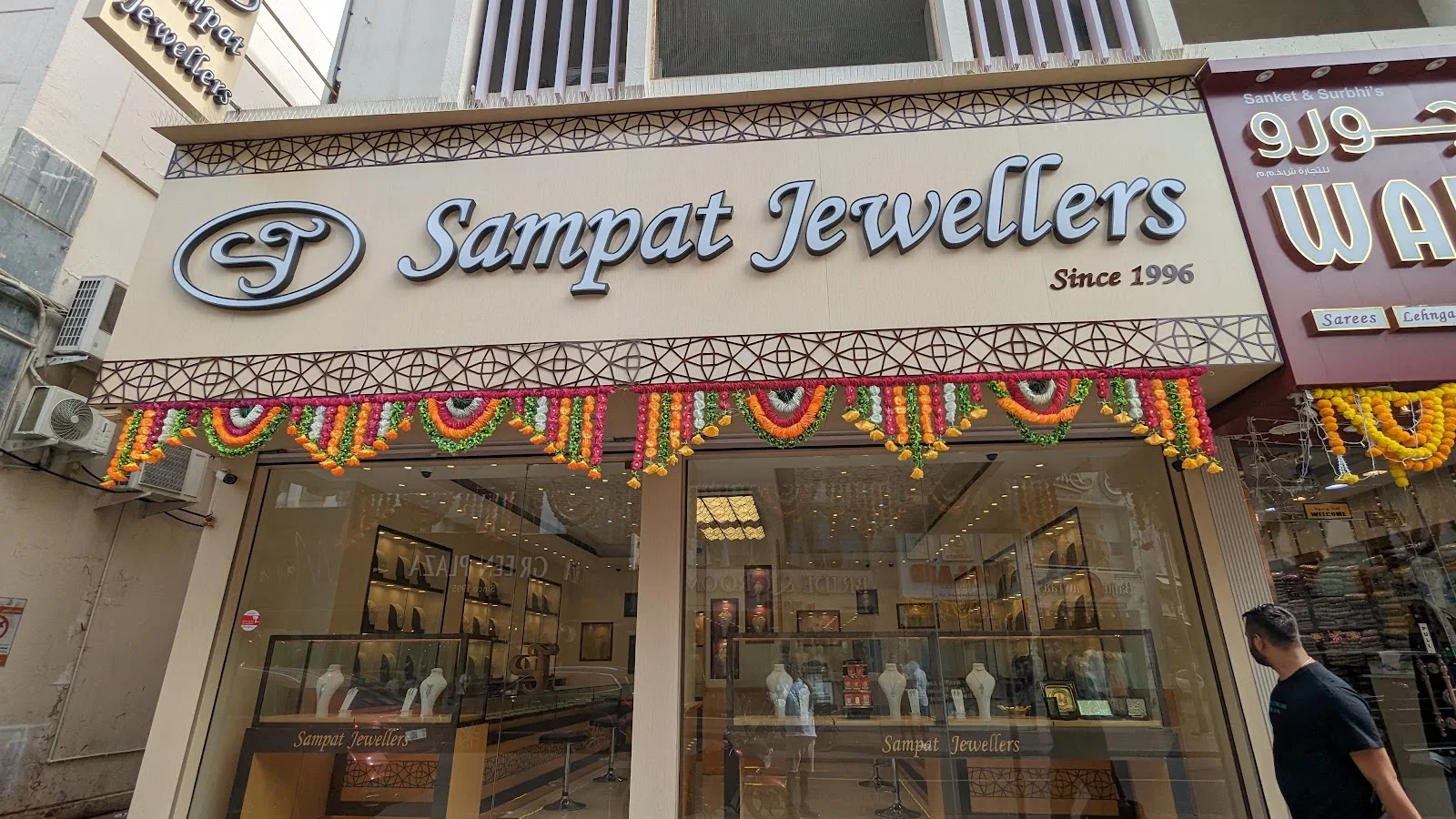 Sampat Jewellers storefront in Meena Bazar, Dubai, with the gold display windows and Since 1996 signage