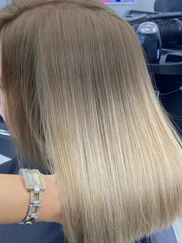 Glossy straightened hair styled in the salon