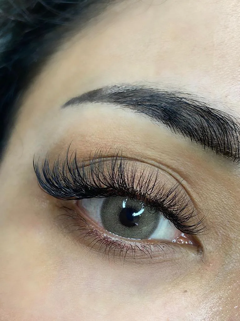 Close-up of classic lash extensions and shaped brow