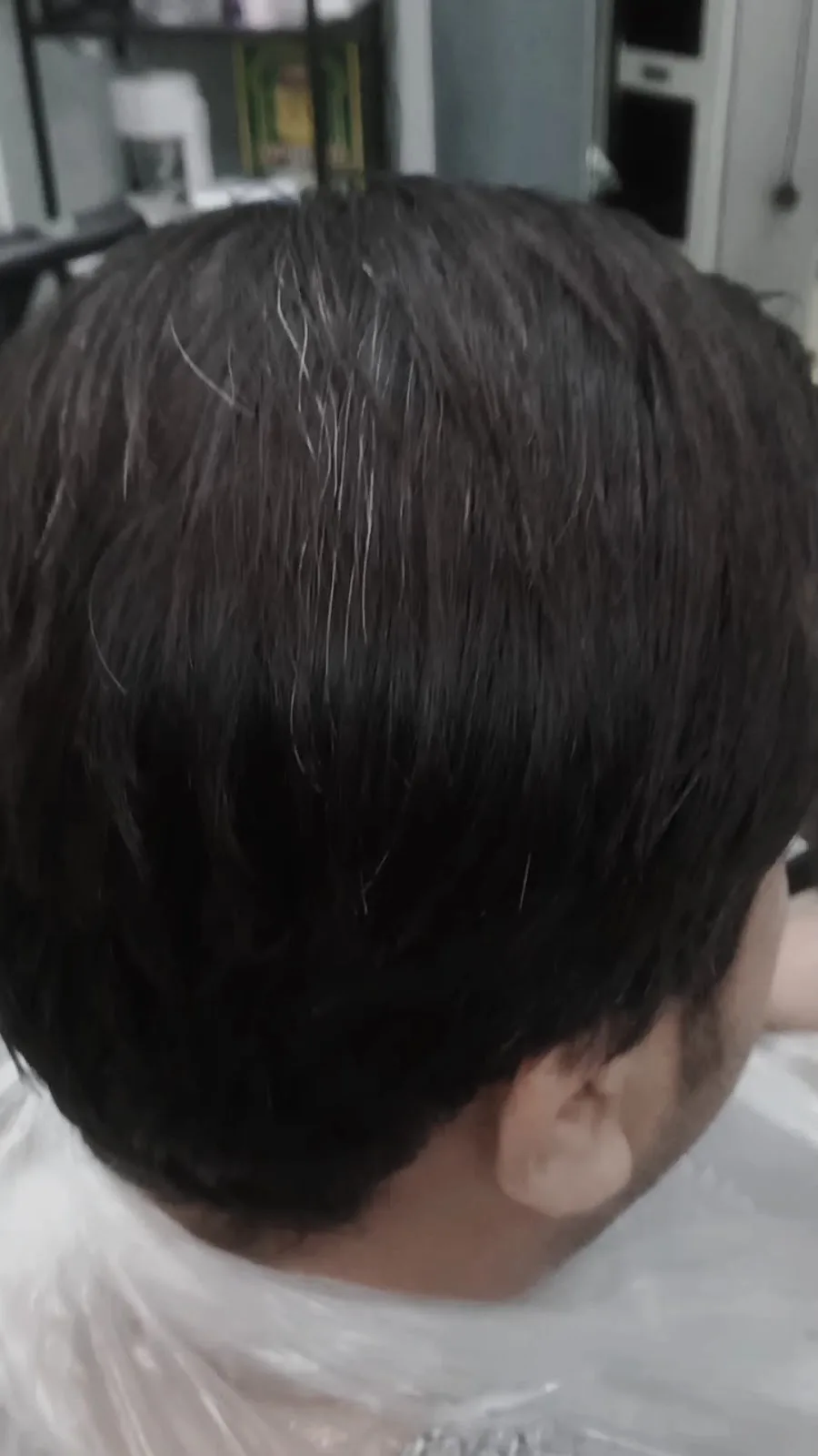 Close detail of a finished neat haircut from behind
