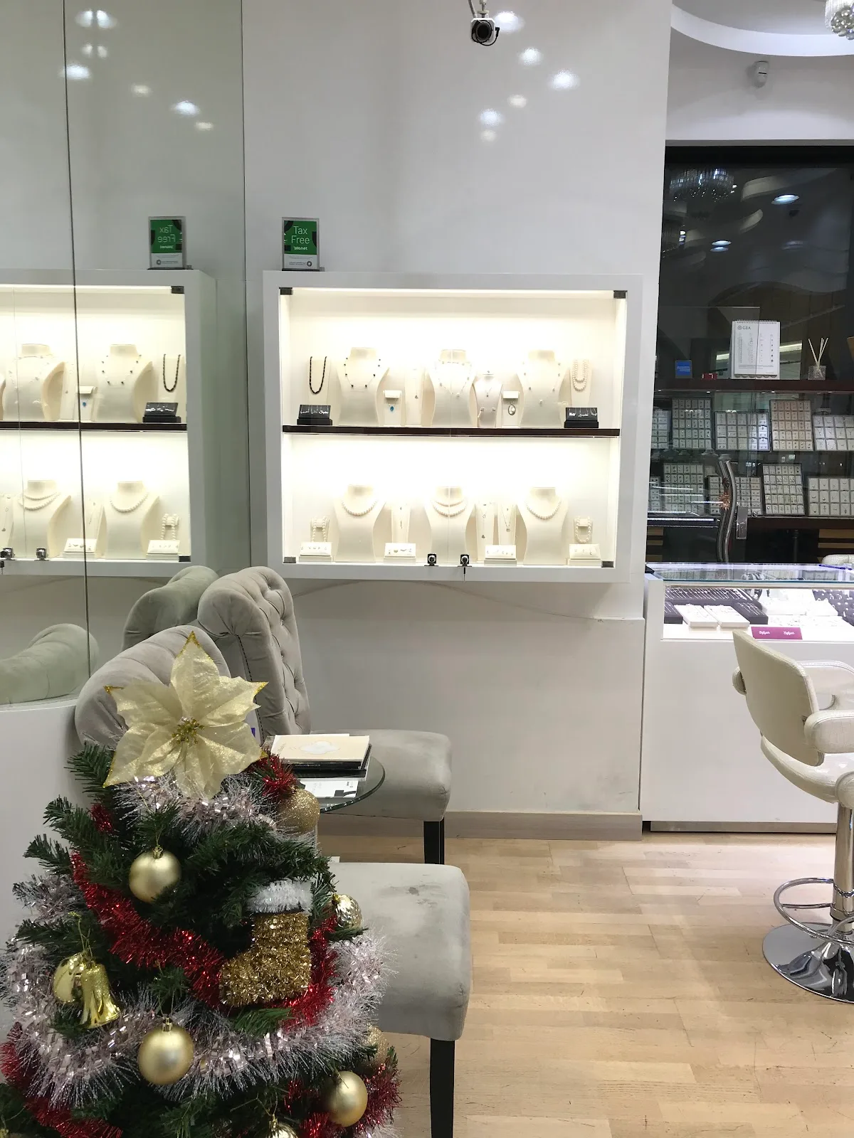 Lit display shelves of necklaces and pearls at Safiyah