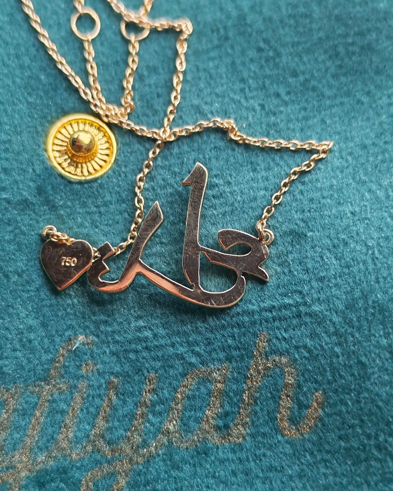 Personalised gold name pendant in a Safiyah pouch