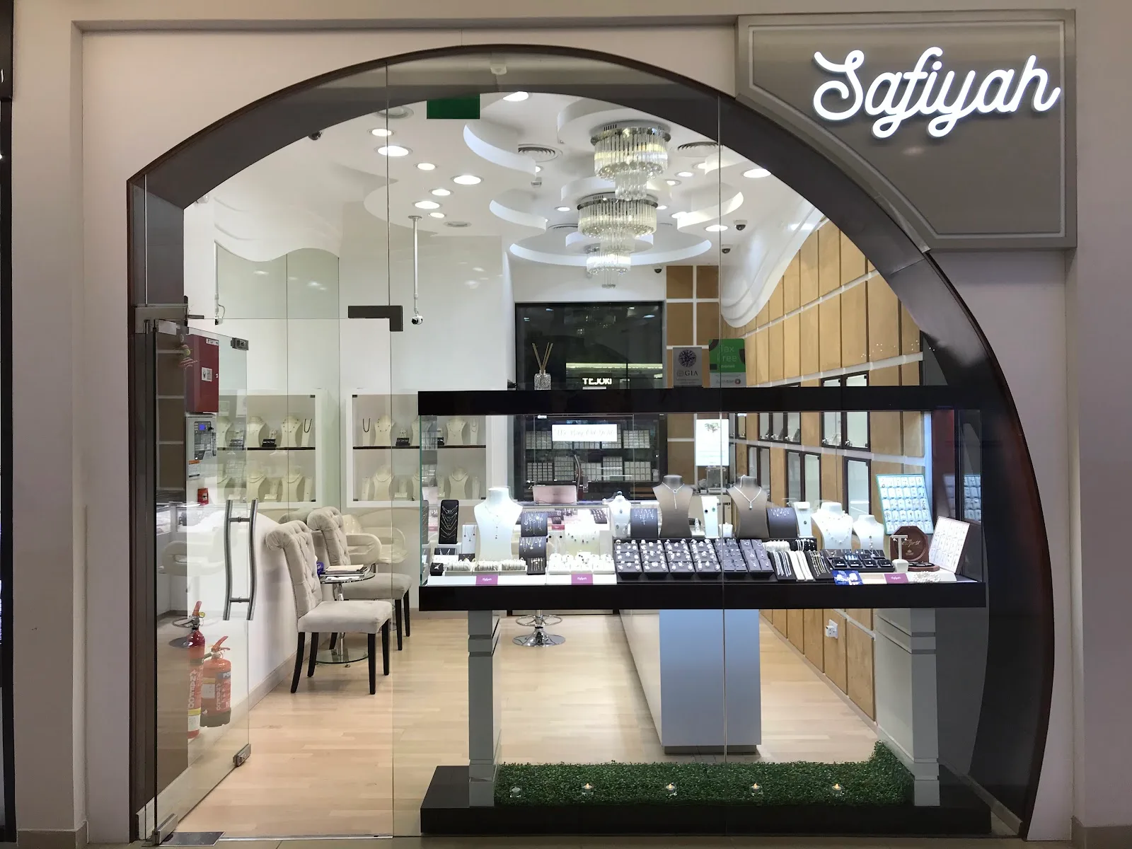 Safiyah storefront with illuminated script signage in Gold & Diamond Park, Dubai