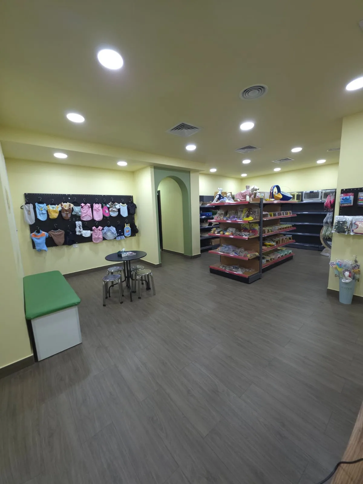 Wide view of the Pet Moment shop floor with product shelving