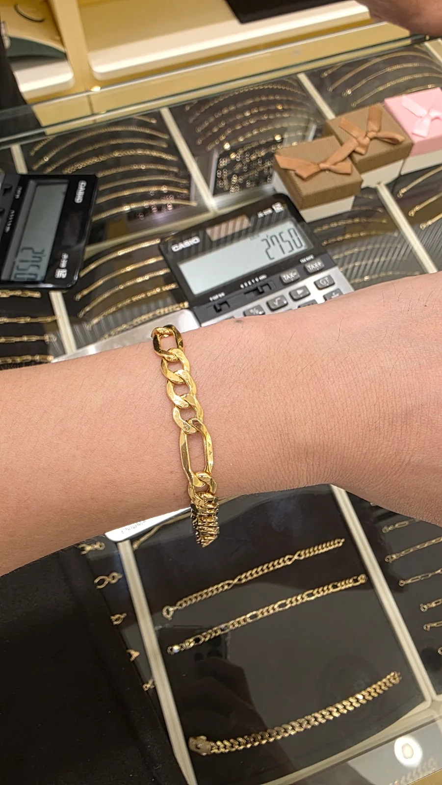 Gold bracelet shown on a wrist at Top Pure Jewellery