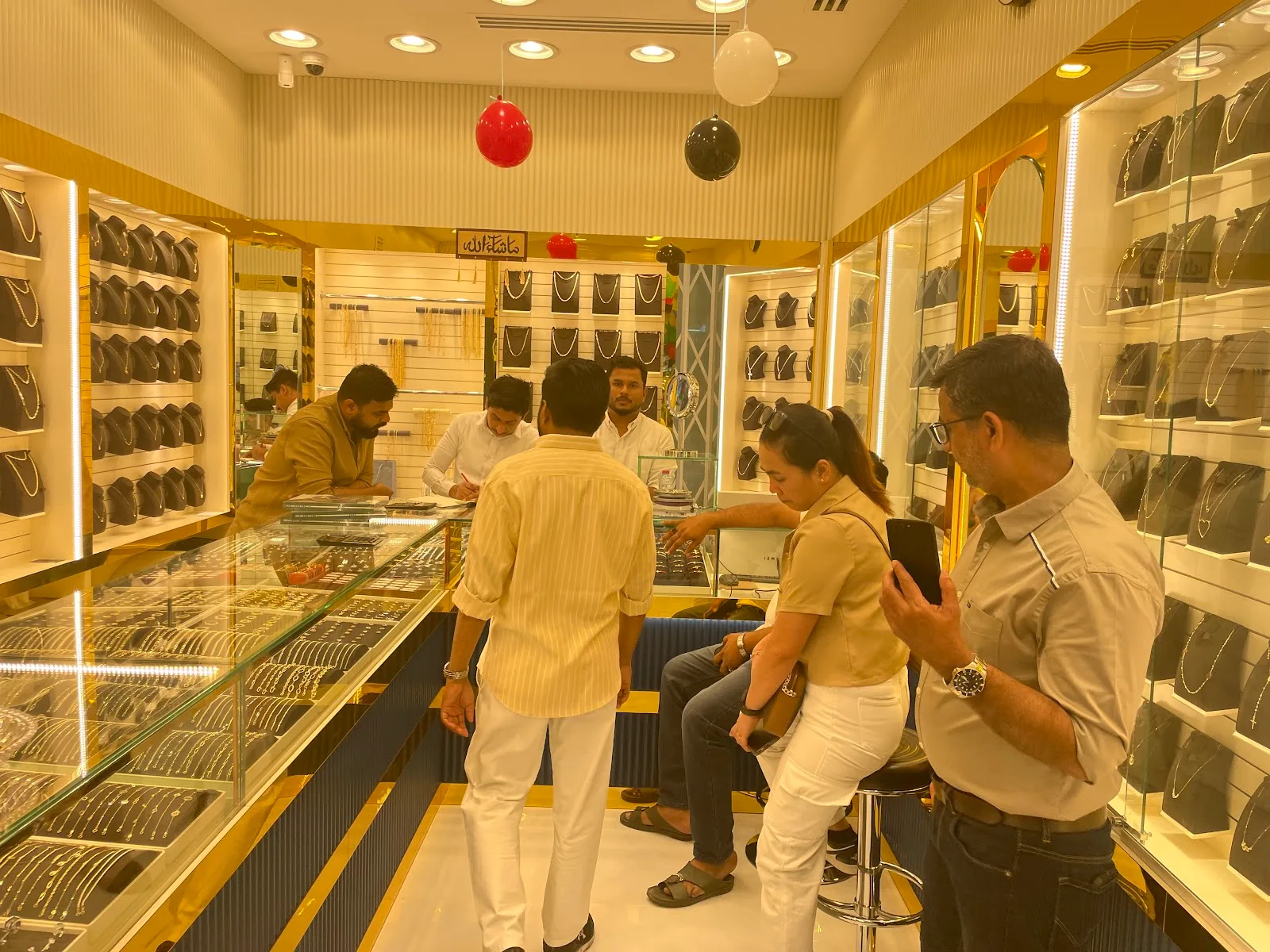 Customers being served at the counters inside Top Pure Jewellery
