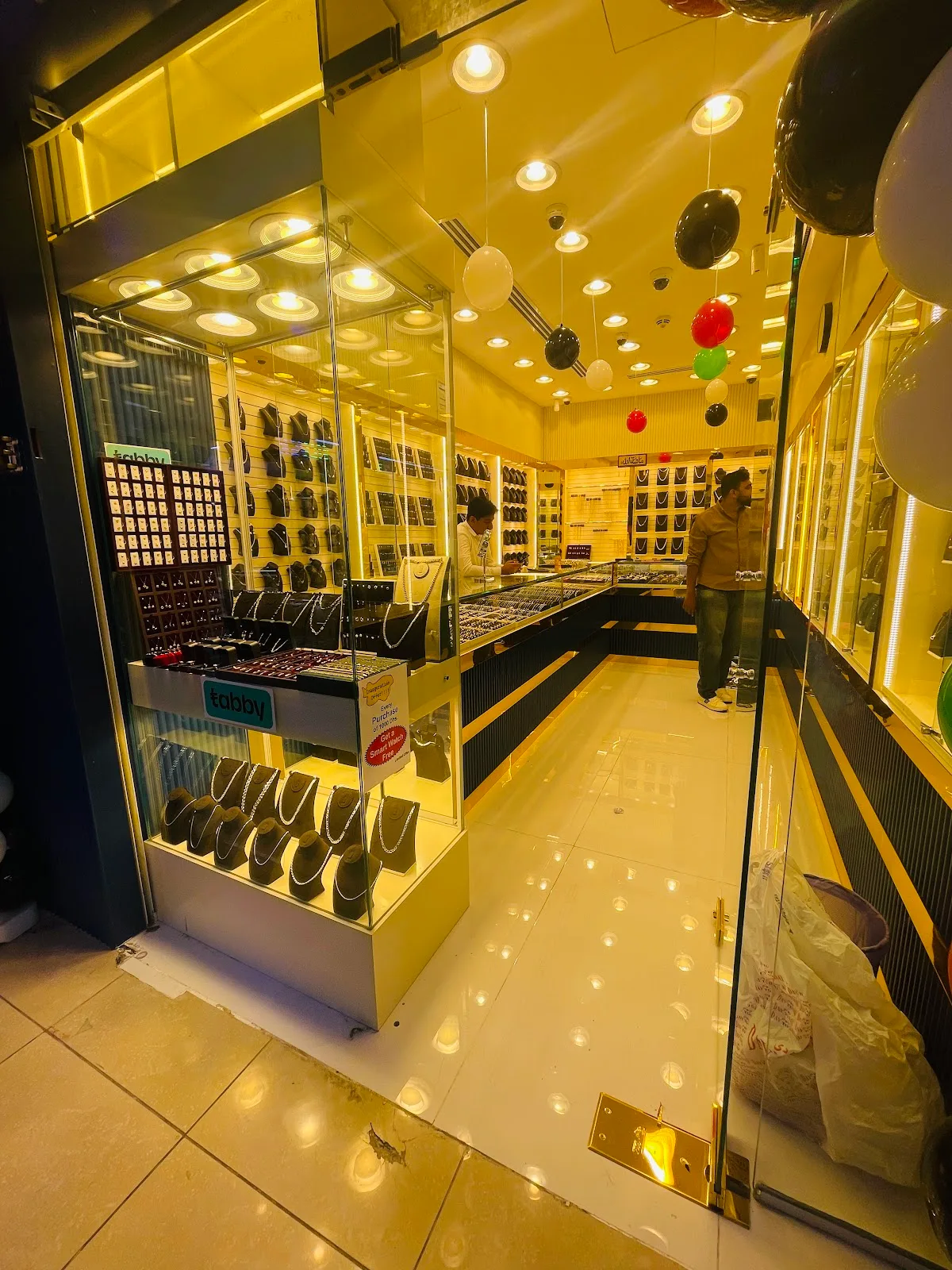 Warm interior of Top Pure Jewellery with lit display cabinets
