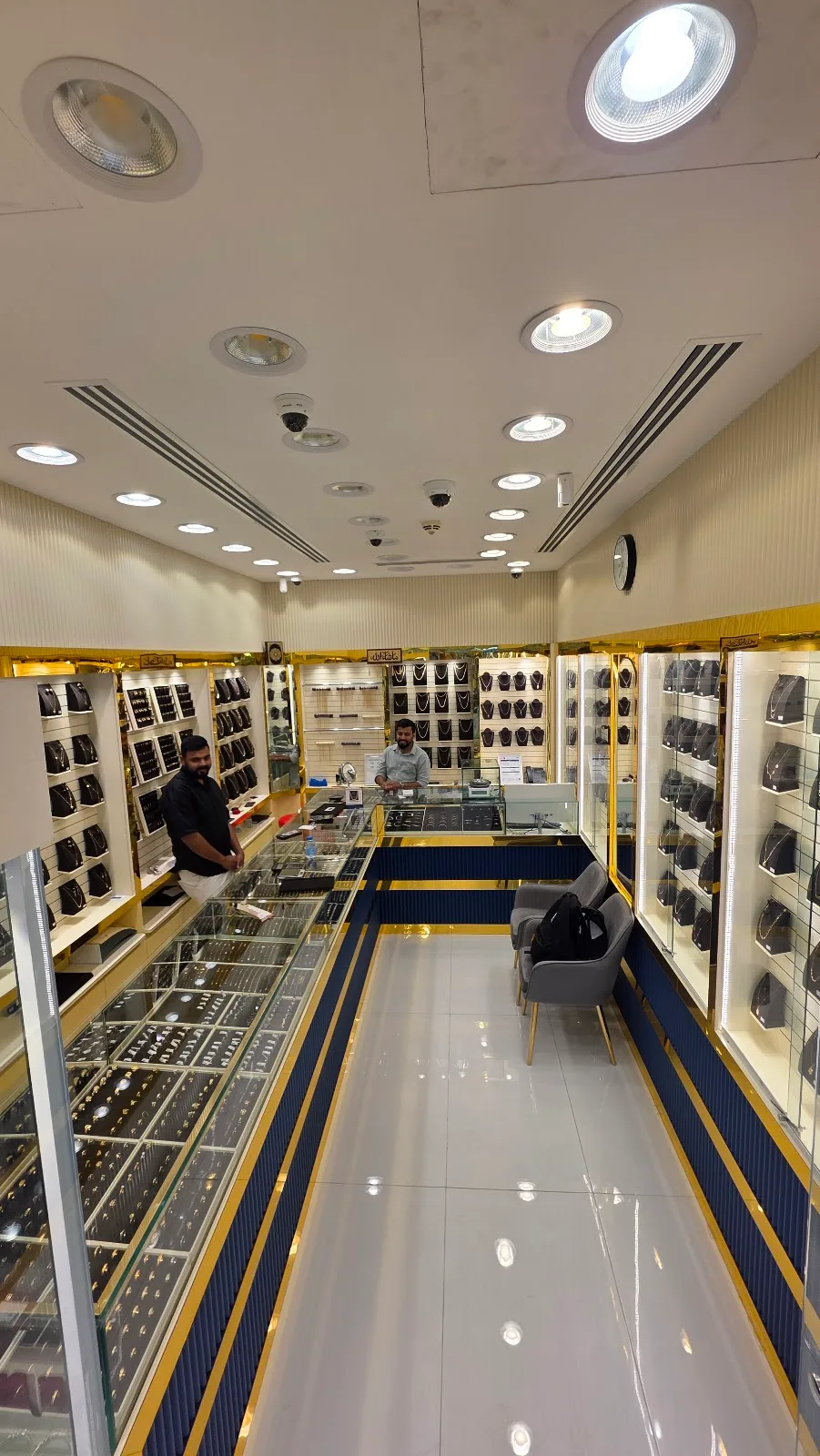 Wide view of the Top Pure Jewellery showroom with gold and navy fittings