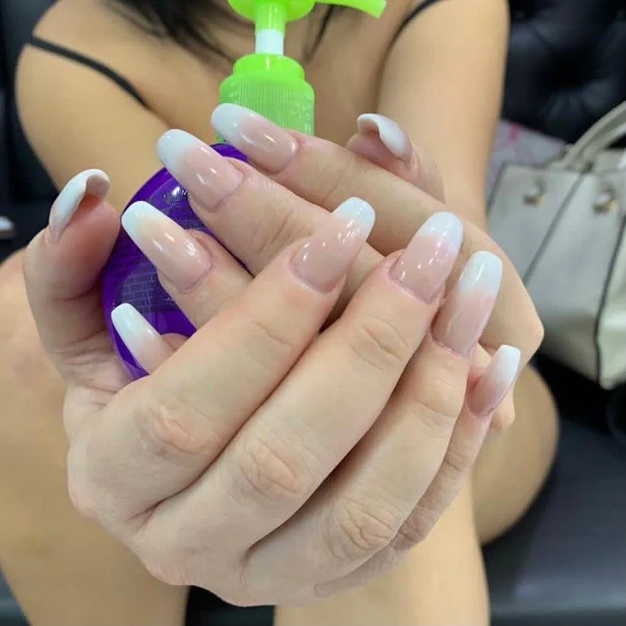 French ombré nails on long almond tips