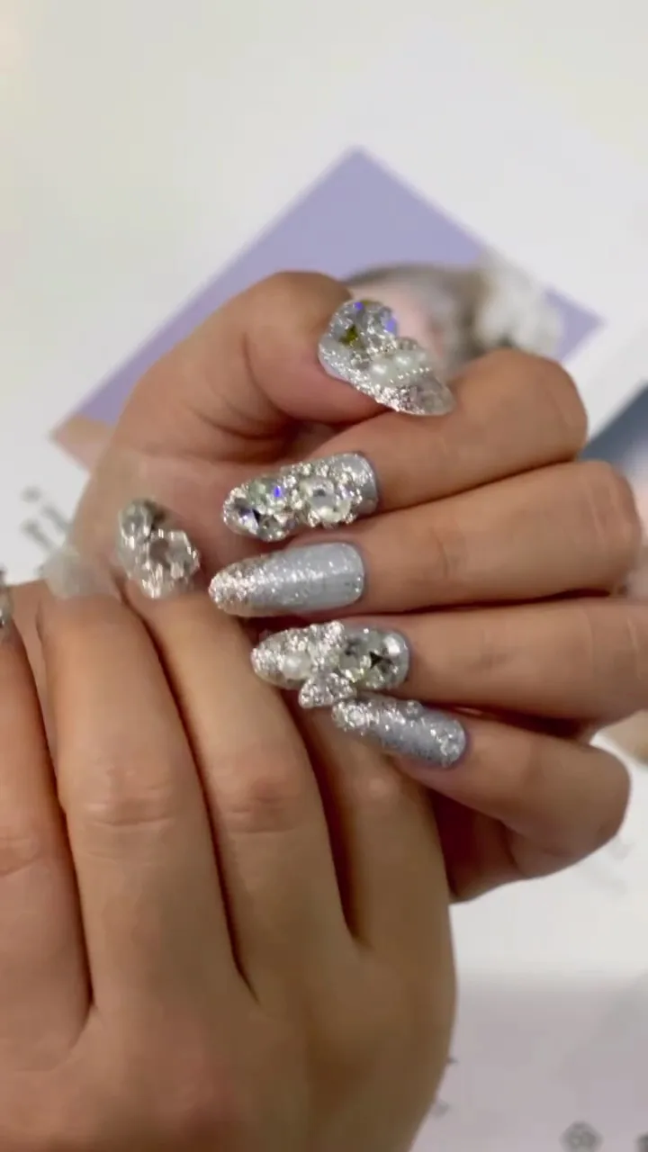 Statement nails with silver glitter and crystal detailing