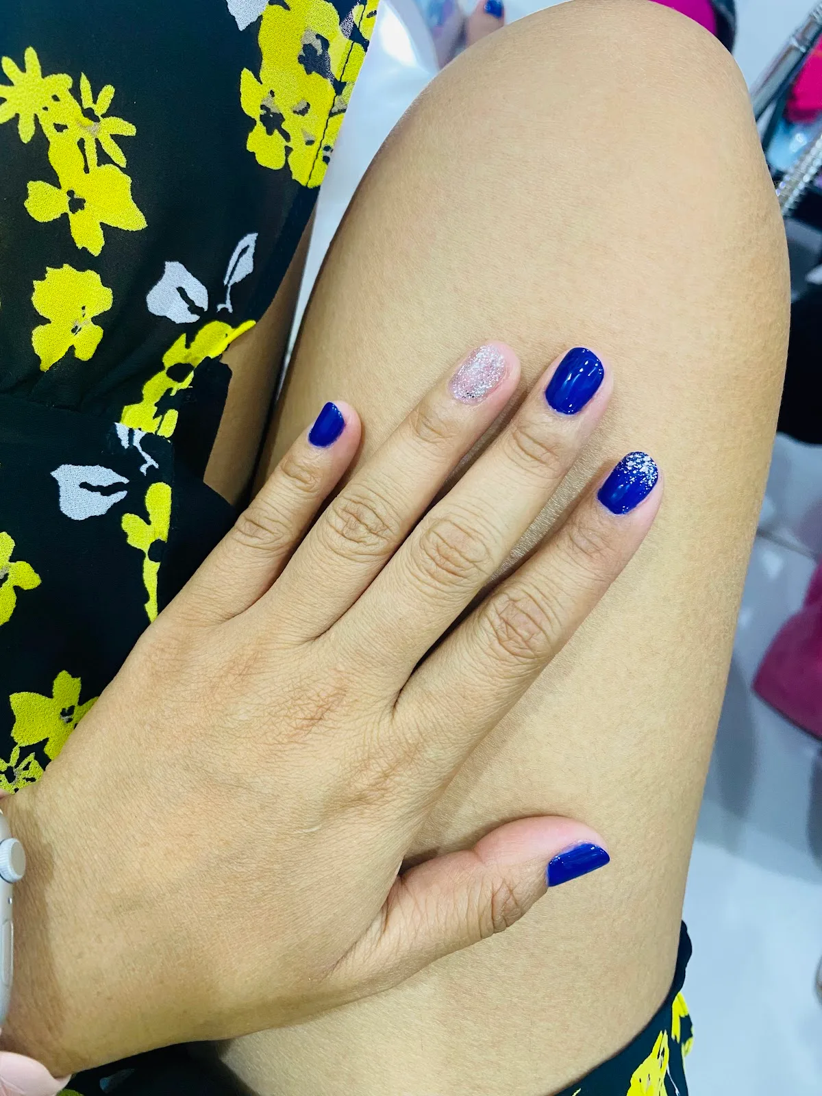 Cobalt blue gel manicure with silver glitter accent nails