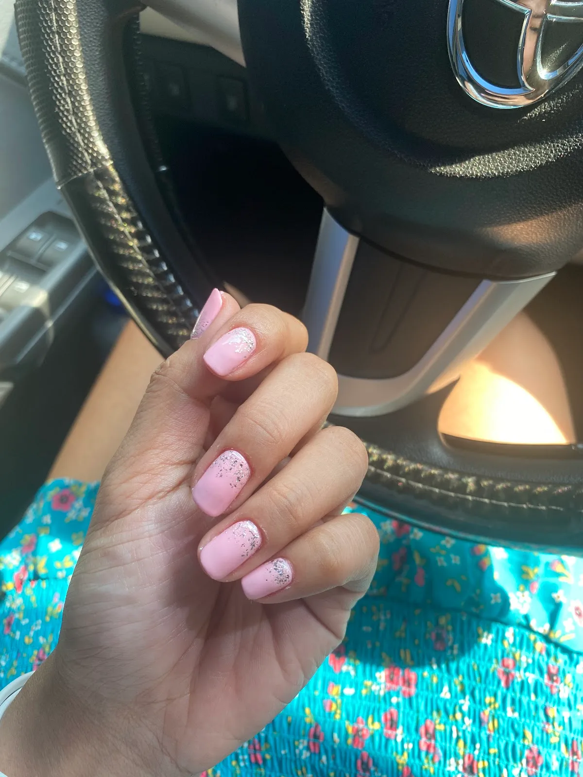 Soft pink gel nails with silver glitter detail