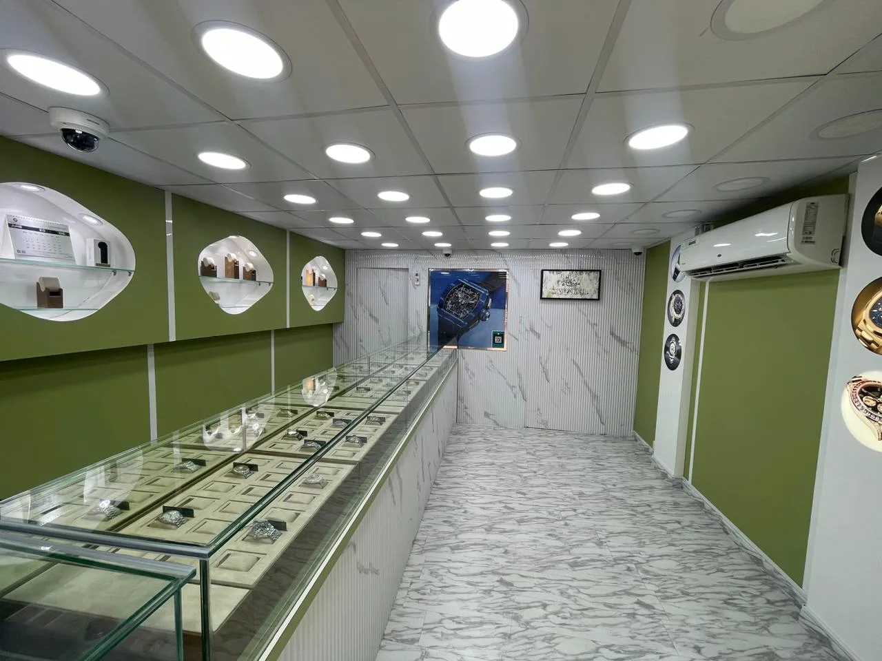The Be on Time Watches interior with a long glass display counter of timepieces
