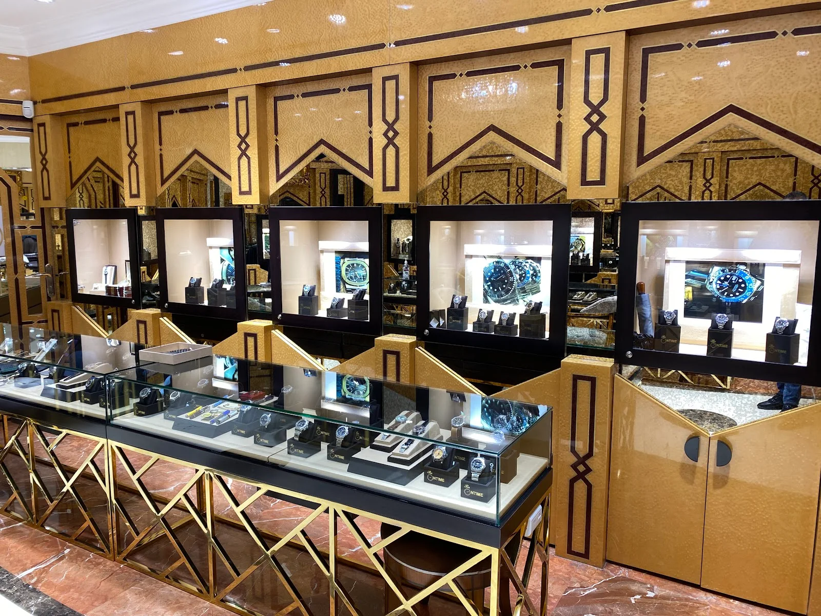 Inside the Be on Time Watches showroom on Al Rigga in Deira, Dubai, with illuminated display cases of timepieces