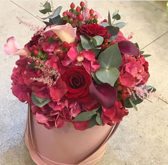 Red and pink hydrangea and calla arrangement