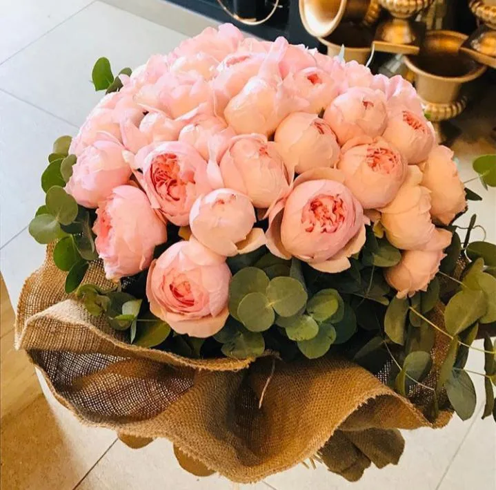 Blush peonies wrapped in burlap