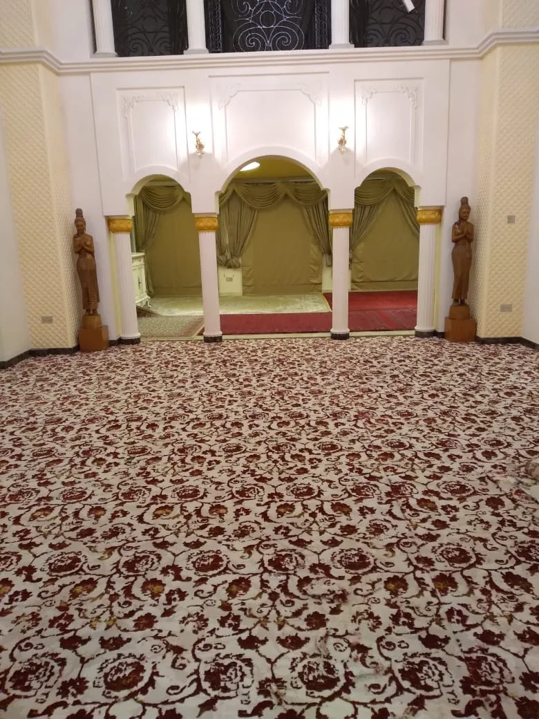 A grand Dubai majlis fully fitted with patterned wall-to-wall carpet by Green Mountain Furniture Trading